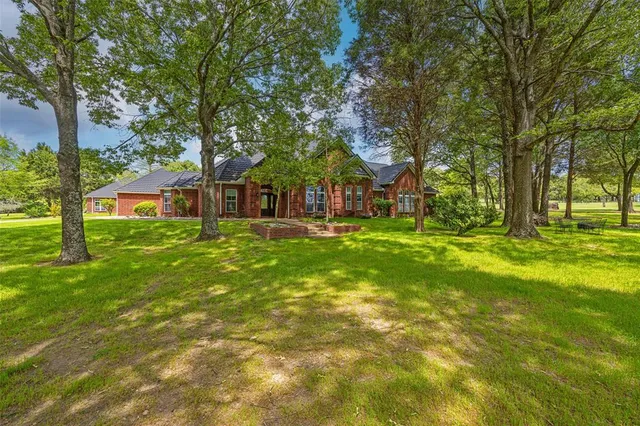 a house view with swimming pool