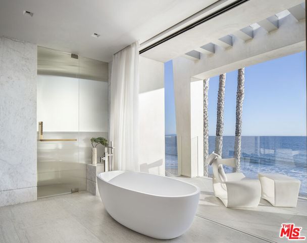 a bathroom with a double vanity sink toilet and a mirror