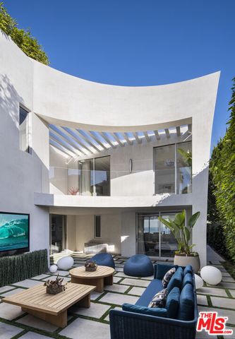 a view of a building with sitting area