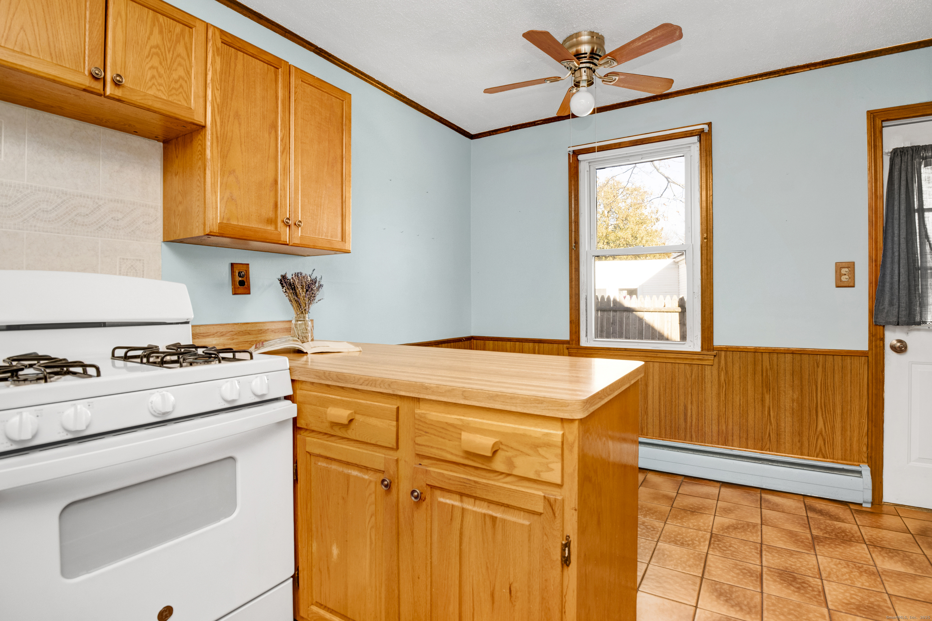 75 Lafayette Street Hartford, CT 06106 - Photo 21 of 38 a kitchen with stainless steel appliances granite countertop a stove and a refrigerator