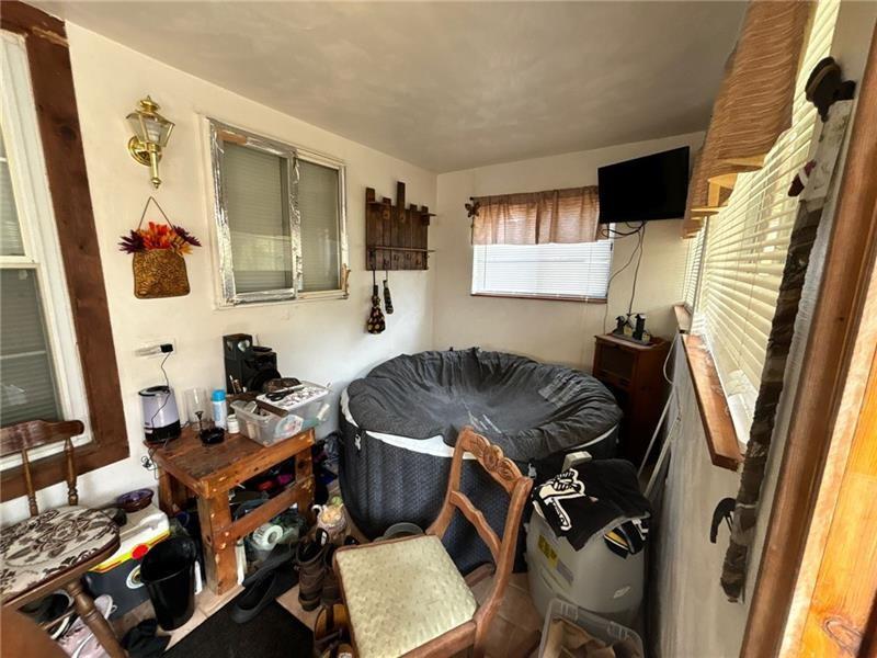 170 Portman Street McKees Rocks, PA 15136 - Photo 11 of 24 a living room with furniture and a flat screen tv