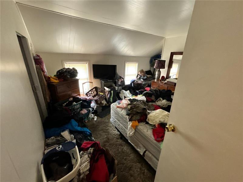 170 Portman Street McKees Rocks, PA 15136 - Photo 14 of 24 a living room with furniture and a flat screen tv
