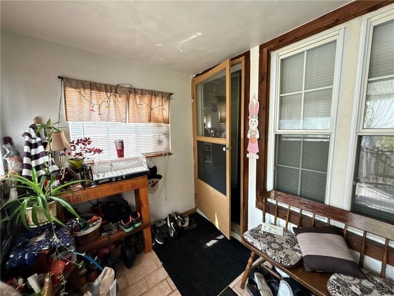 170 Portman Street McKees Rocks, PA 15136 - Photo 5 of 24 a room with furniture potted plant and a window