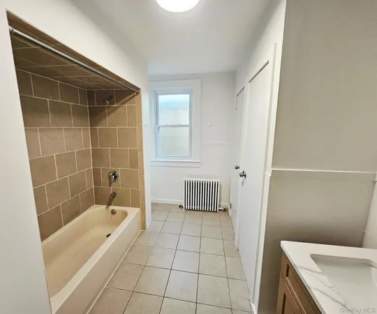 a bathroom with a bathtub and toilet