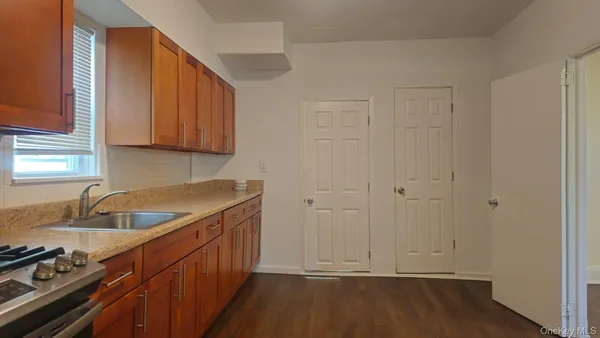 a kitchen that has a sink and a stove