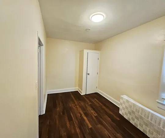 a view of room with wooden floor