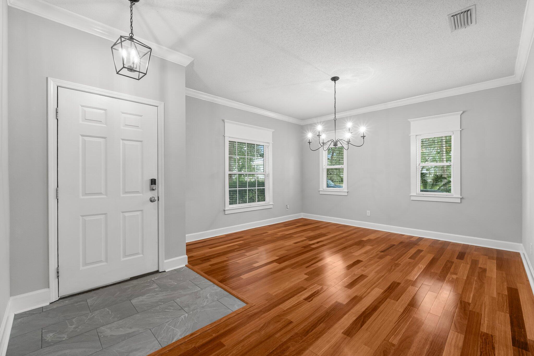 1083 Bay Grove Road Freeport, FL 32439 - Photo 3 of 41 a view of empty room with wooden floor and window