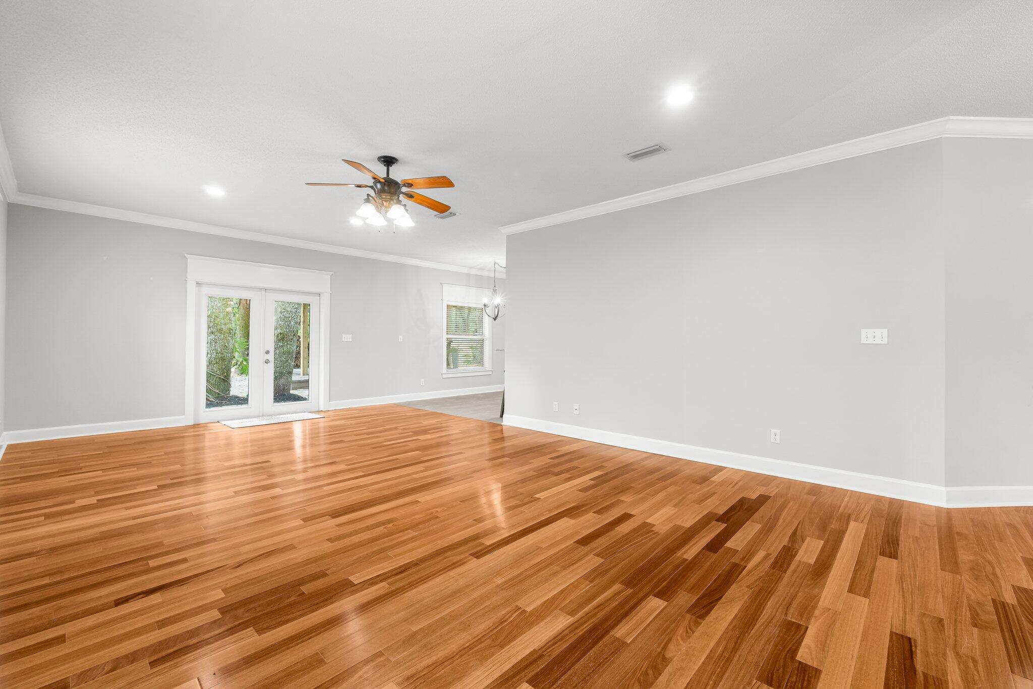 1083 Bay Grove Road Freeport, FL 32439 - Photo 7 of 41 wooden floor in an empty room with a window