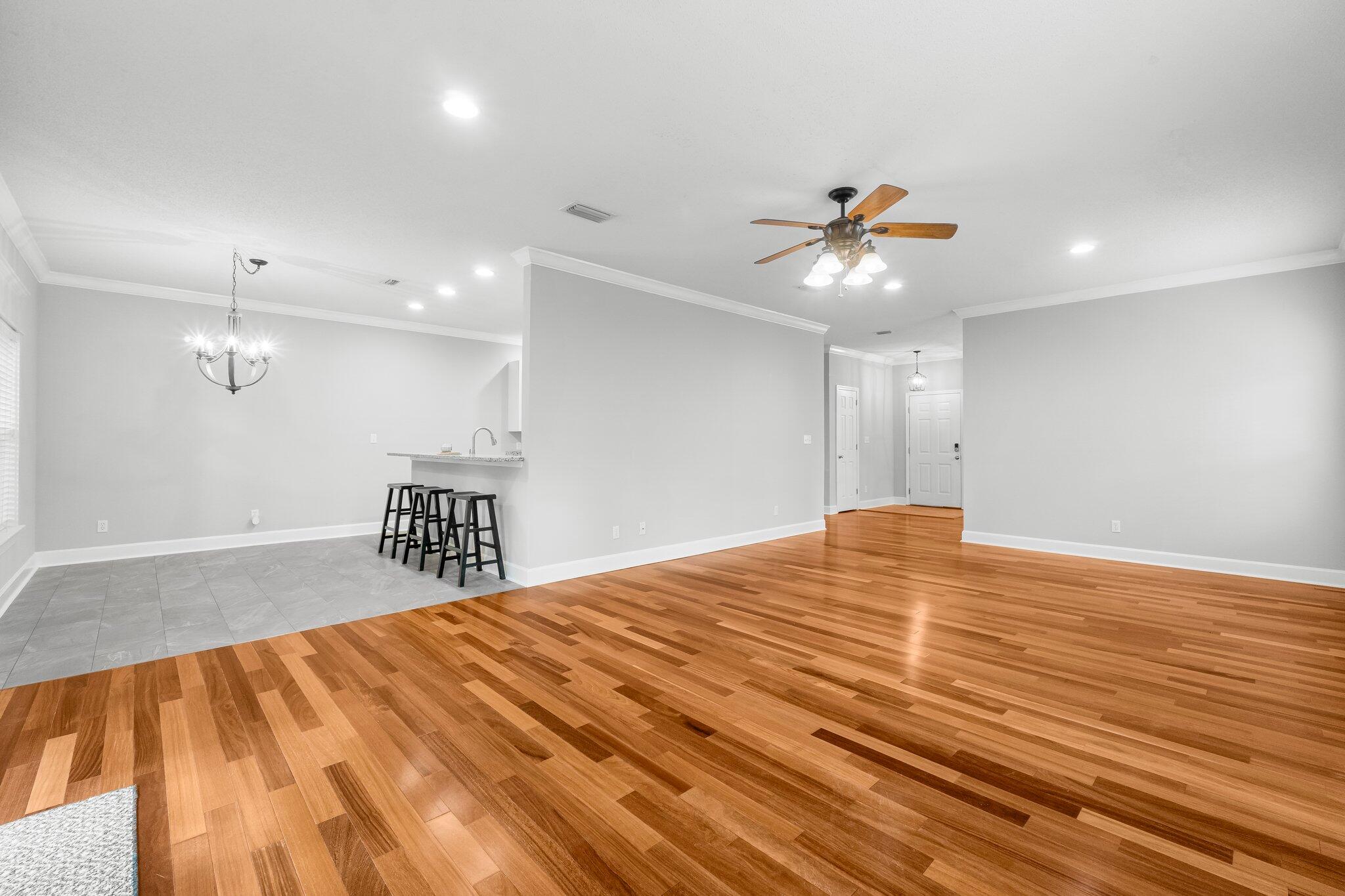 1083 Bay Grove Road Freeport, FL 32439 - Photo 9 of 41 a bedroom with a bed and a chandelier