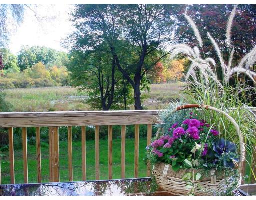18 Brookside Road Needham, MA 02492 - Photo 1 of 10 a view of a flower garden in front of a house