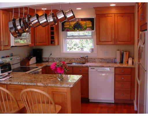 18 Brookside Road Needham, MA 02492 - Photo 6 of 10 a kitchen with stainless steel appliances granite countertop a stove a sink and a cabinets