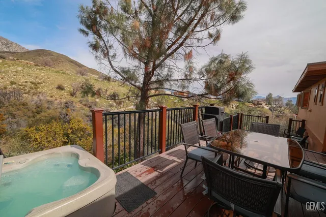 a view of a balcony with wooden fence