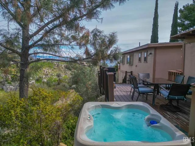 a backyard of a house with yard and outdoor seating