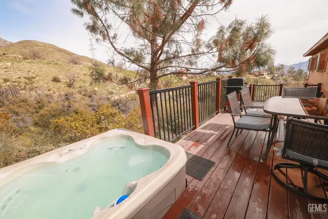 a dining room with furniture window and wooden floor
