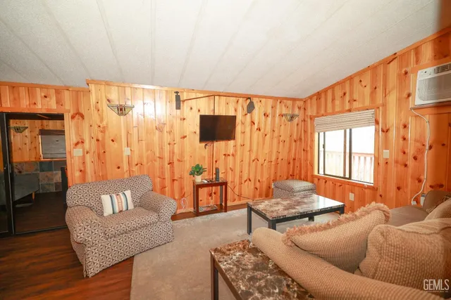 a bathroom with a granite countertop sink a mirror and shower