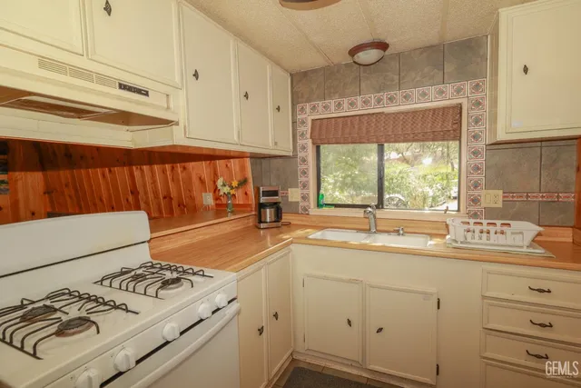 a sitting area with furniture on wooden floor