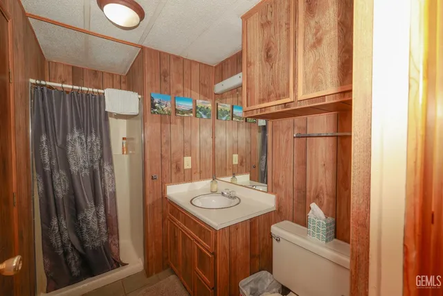 a view of a balcony with chairs and wooden floor