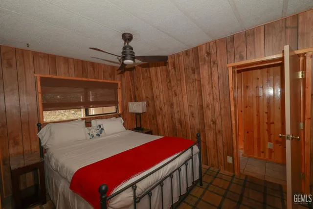 a balcony with wooden floor and outdoor seating