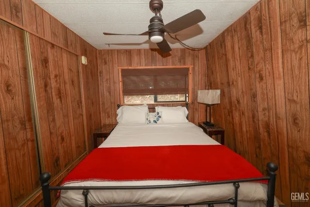 a balcony with wooden floor and outdoor seating