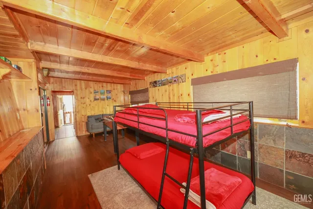 a view of a wooden street with a tree