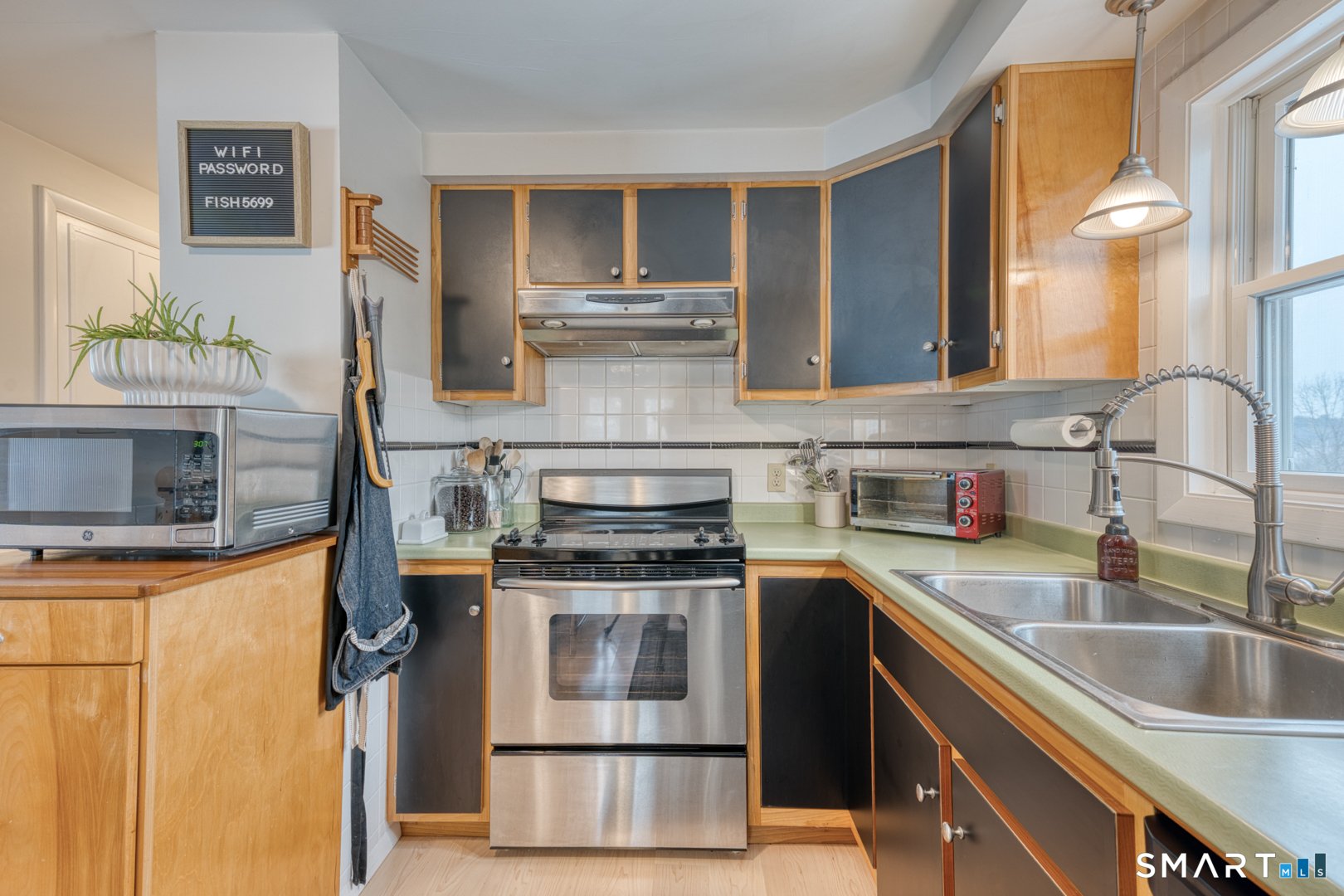 144 Hnath Road Ashford, CT 06278 - Photo 11 of 40 a kitchen with stainless steel appliances granite countertop a sink stove and refrigerator