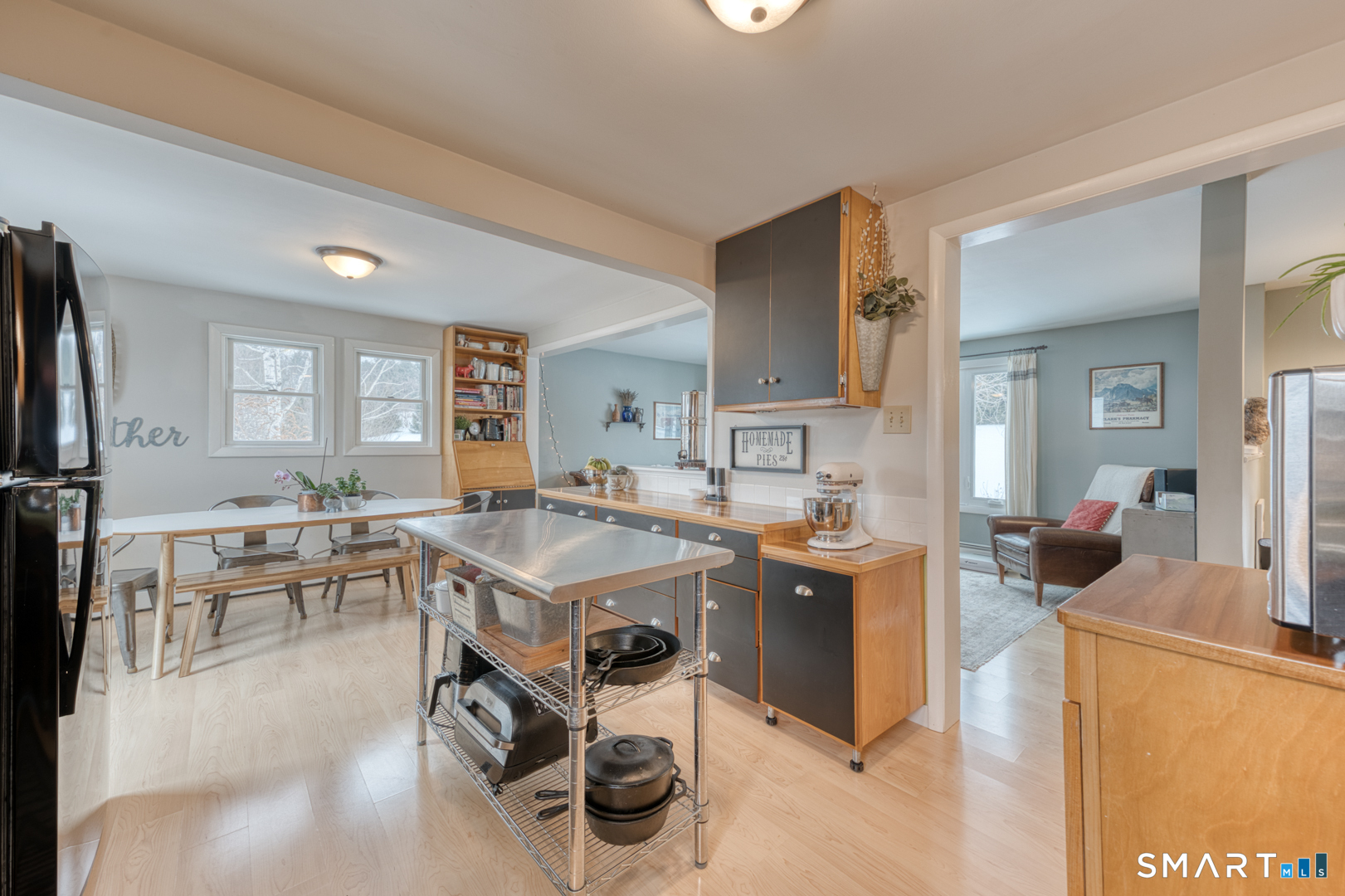 144 Hnath Road Ashford, CT 06278 - Photo 12 of 40 a room with a table chairs and a refrigerator