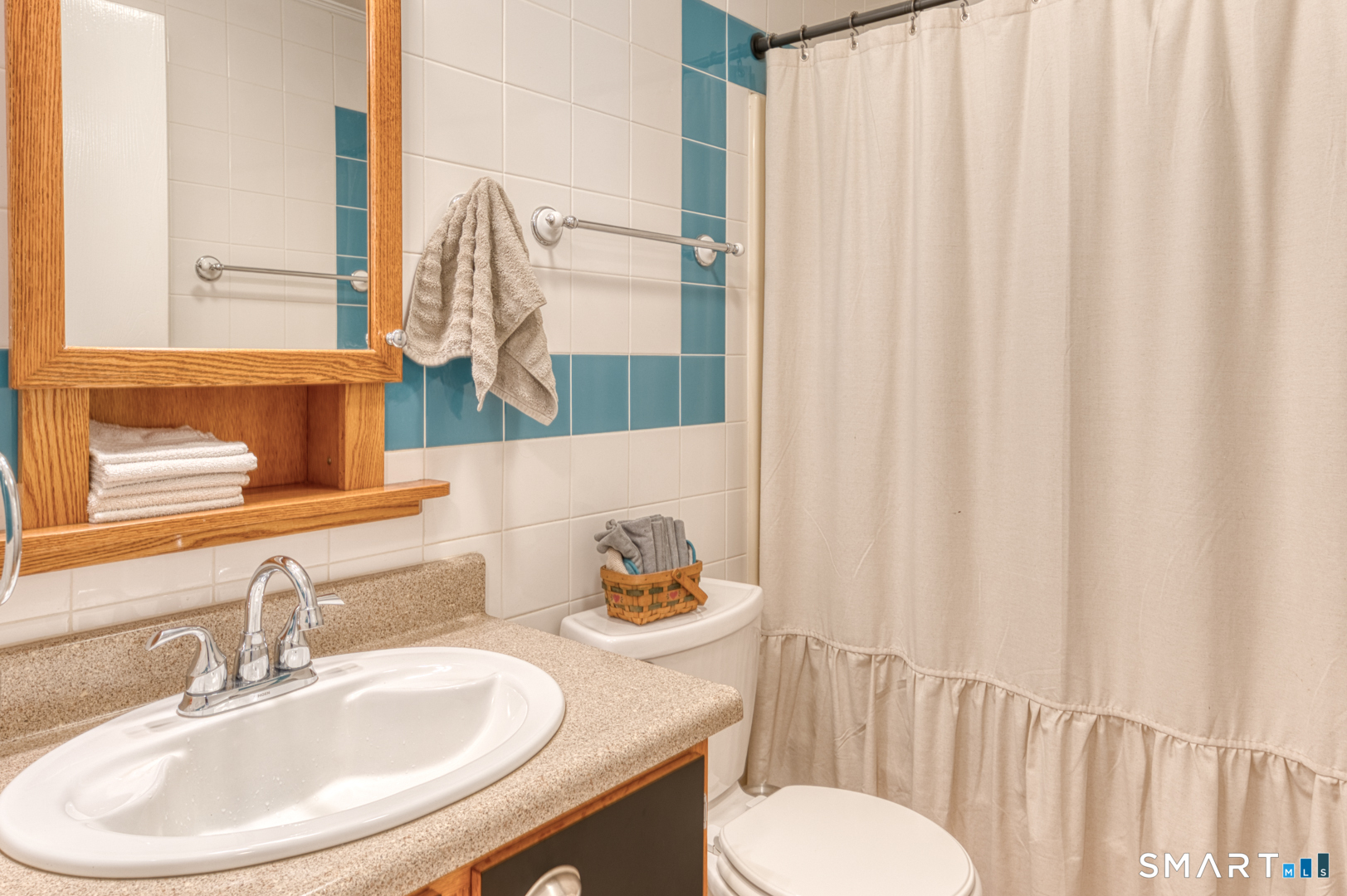 144 Hnath Road Ashford, CT 06278 - Photo 14 of 40 a bathroom with a sink and a mirror