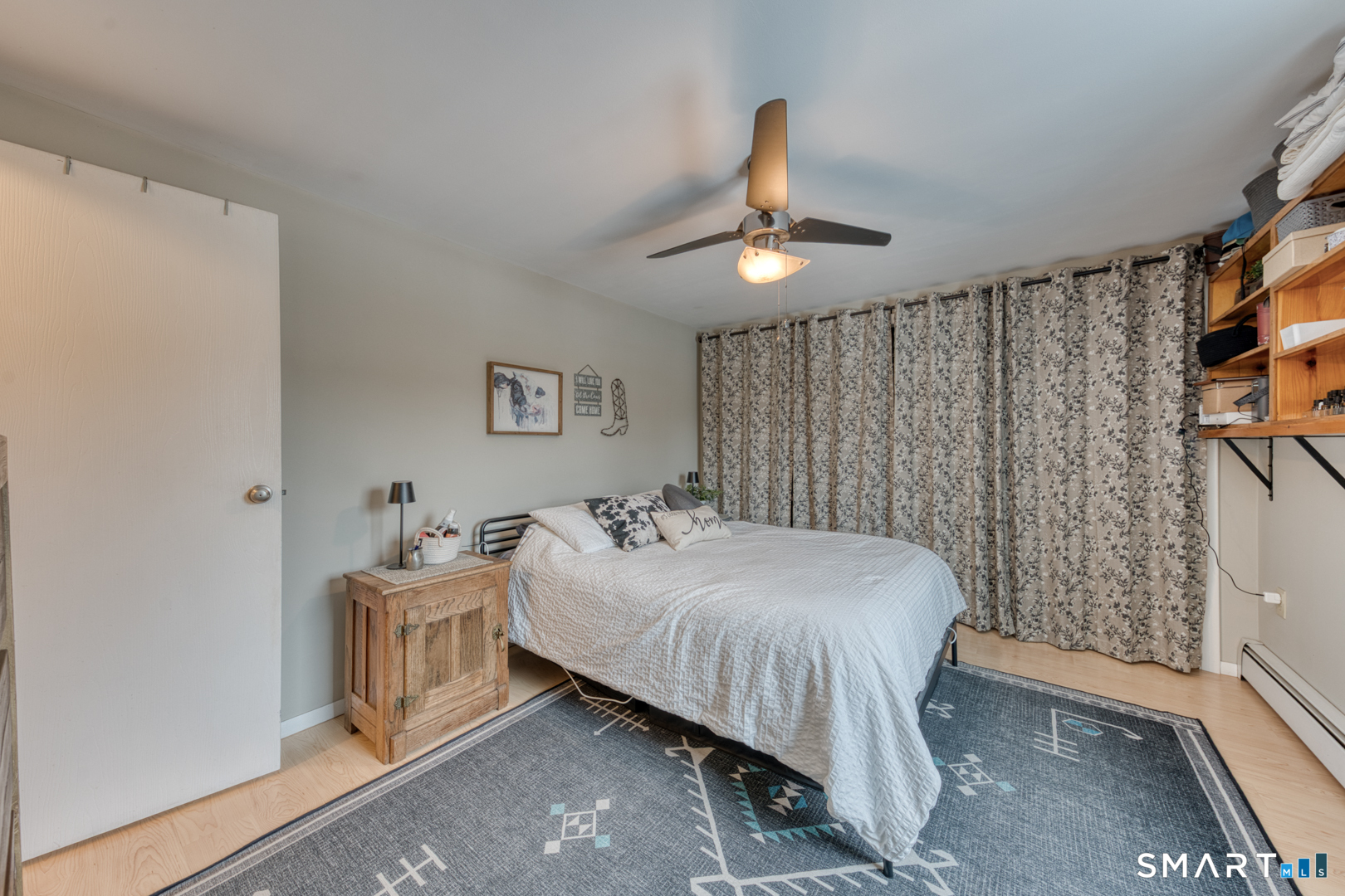 144 Hnath Road Ashford, CT 06278 - Photo 15 of 40 a bedroom with a bed and a chandelier