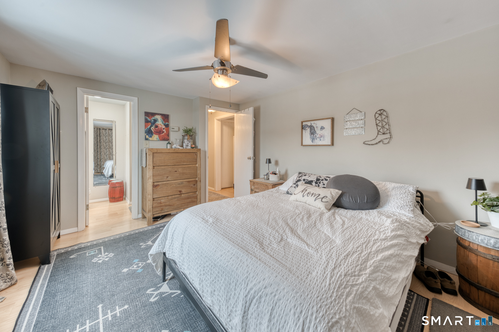 144 Hnath Road Ashford, CT 06278 - Photo 16 of 40 a bedroom with a bed and a chandelier