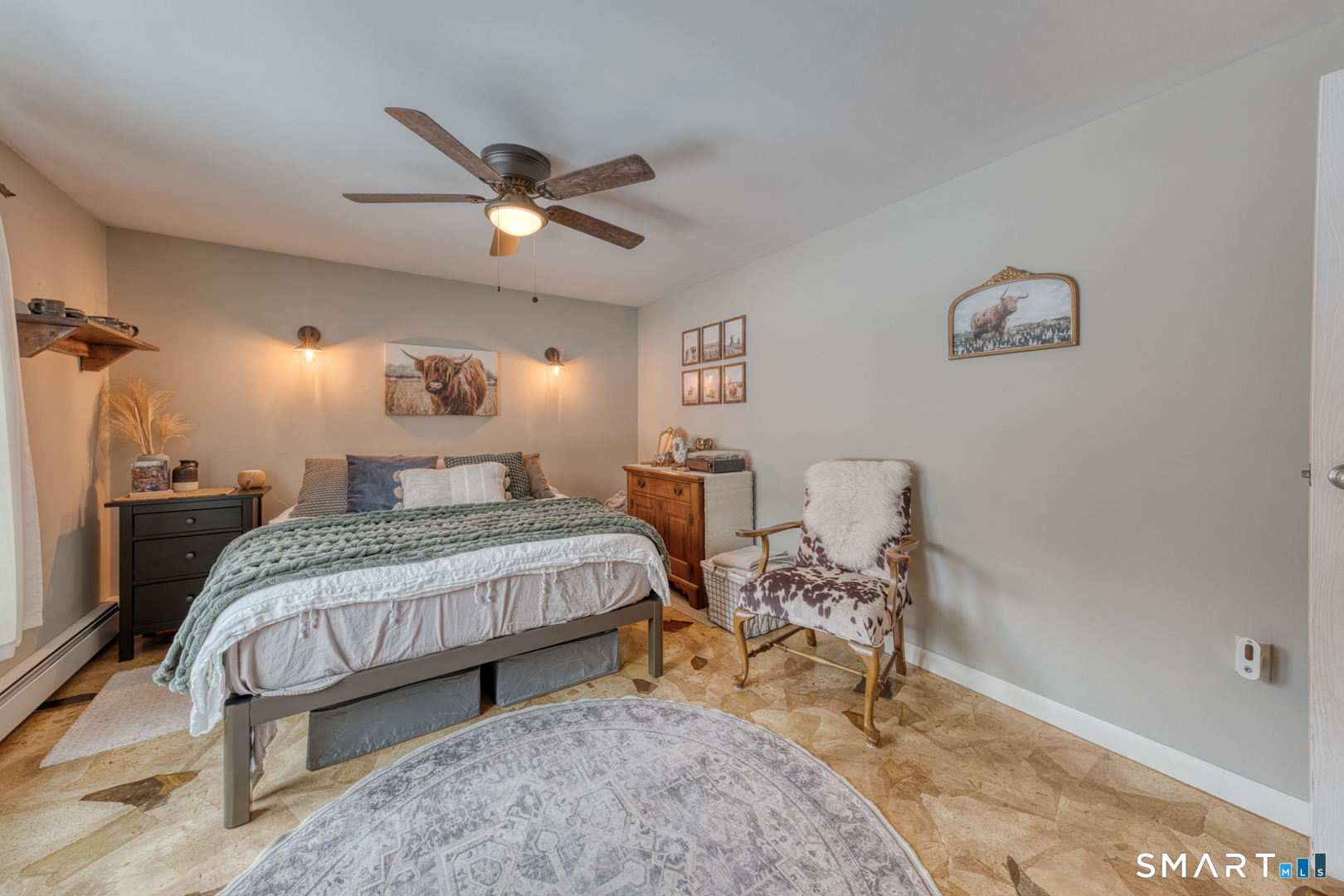 144 Hnath Road Ashford, CT 06278 - Photo 19 of 40 a bedroom with a bed and a chandelier