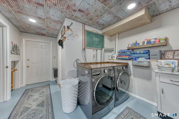 a bedroom with furniture and a air conditioner vent