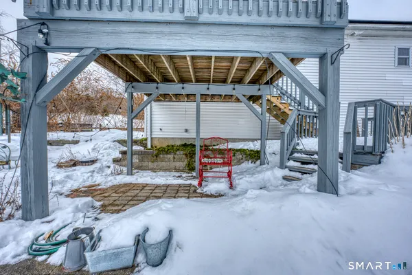 a view of a yard covered with snow in the background