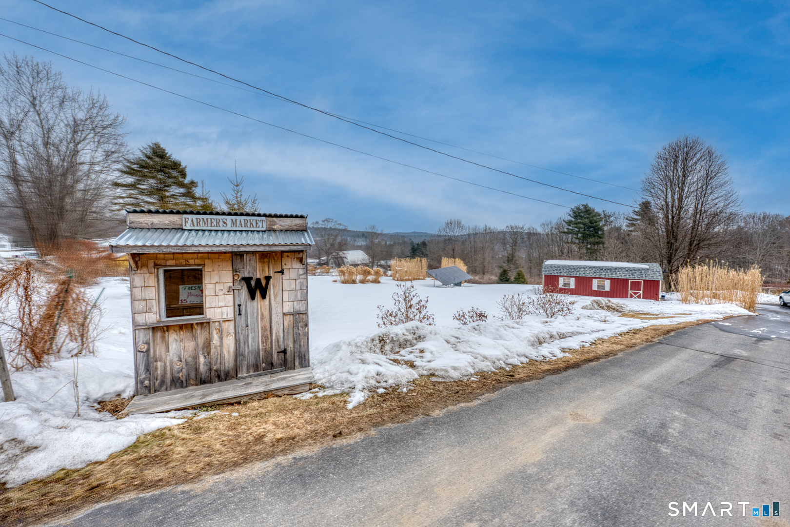 144 Hnath Road Ashford, CT 06278 - Photo 34 of 40 a view of a house with a snow in the yard