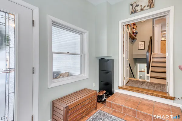 a living room with furniture and a window