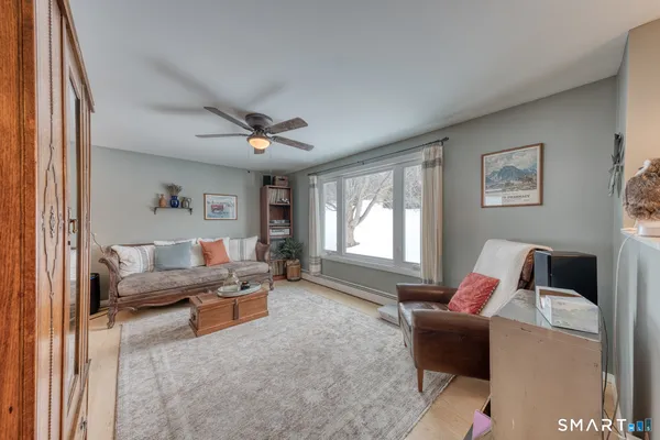 a living room with furniture and a window