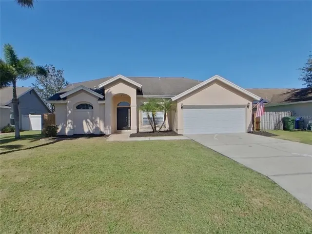 a front view of a house with a garden and porch