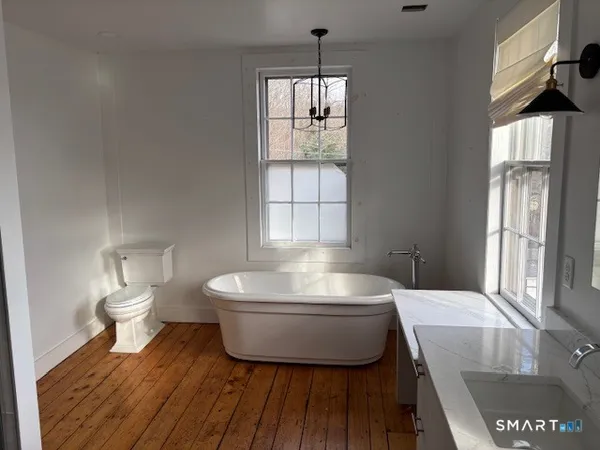 a bathroom with a glass shower door