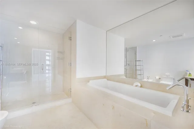 a bathroom with a bathtub and a sink