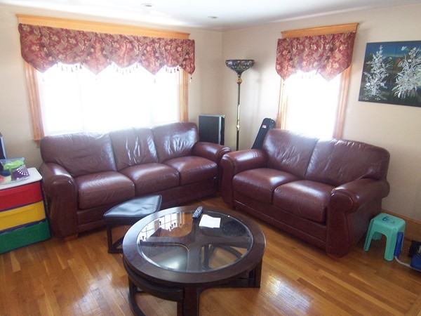 12 Atlas Road Braintree, MA 02184 - Photo 7 of 17 a living room with furniture and a large window