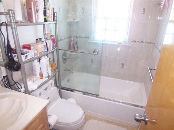 12 Atlas Road Braintree, MA 02184 - Photo 8 of 17 a bathroom with a bathtub toilet and a shower