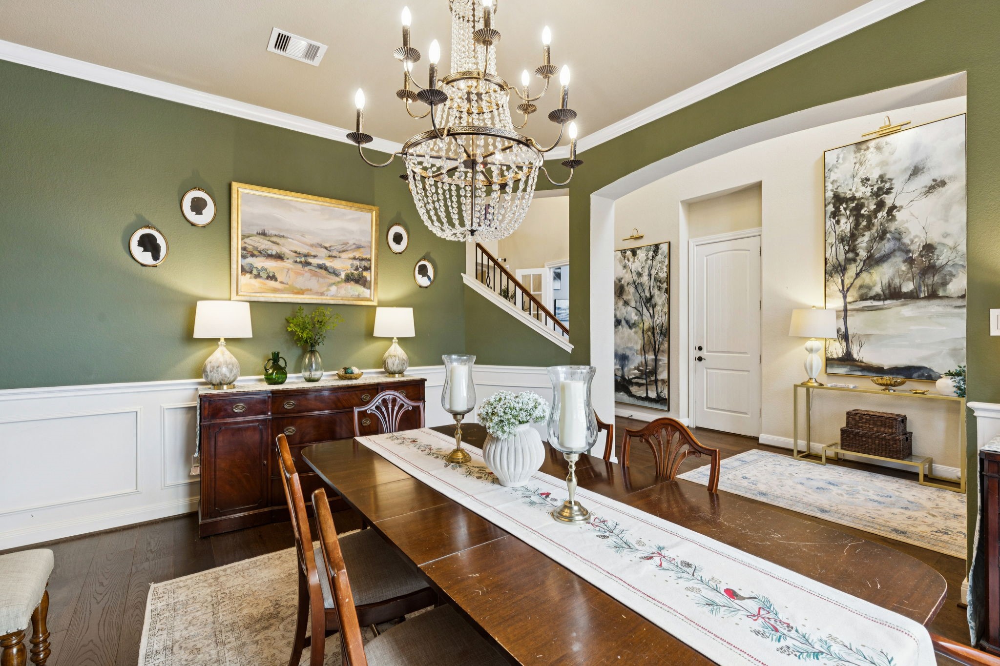 1118 Fragile Sail Court Katy, TX 77494 - Photo 11 of 36 Host unforgettable holiday dinners in this designer dining room highlighted by a crystal chandelier and crown molding.