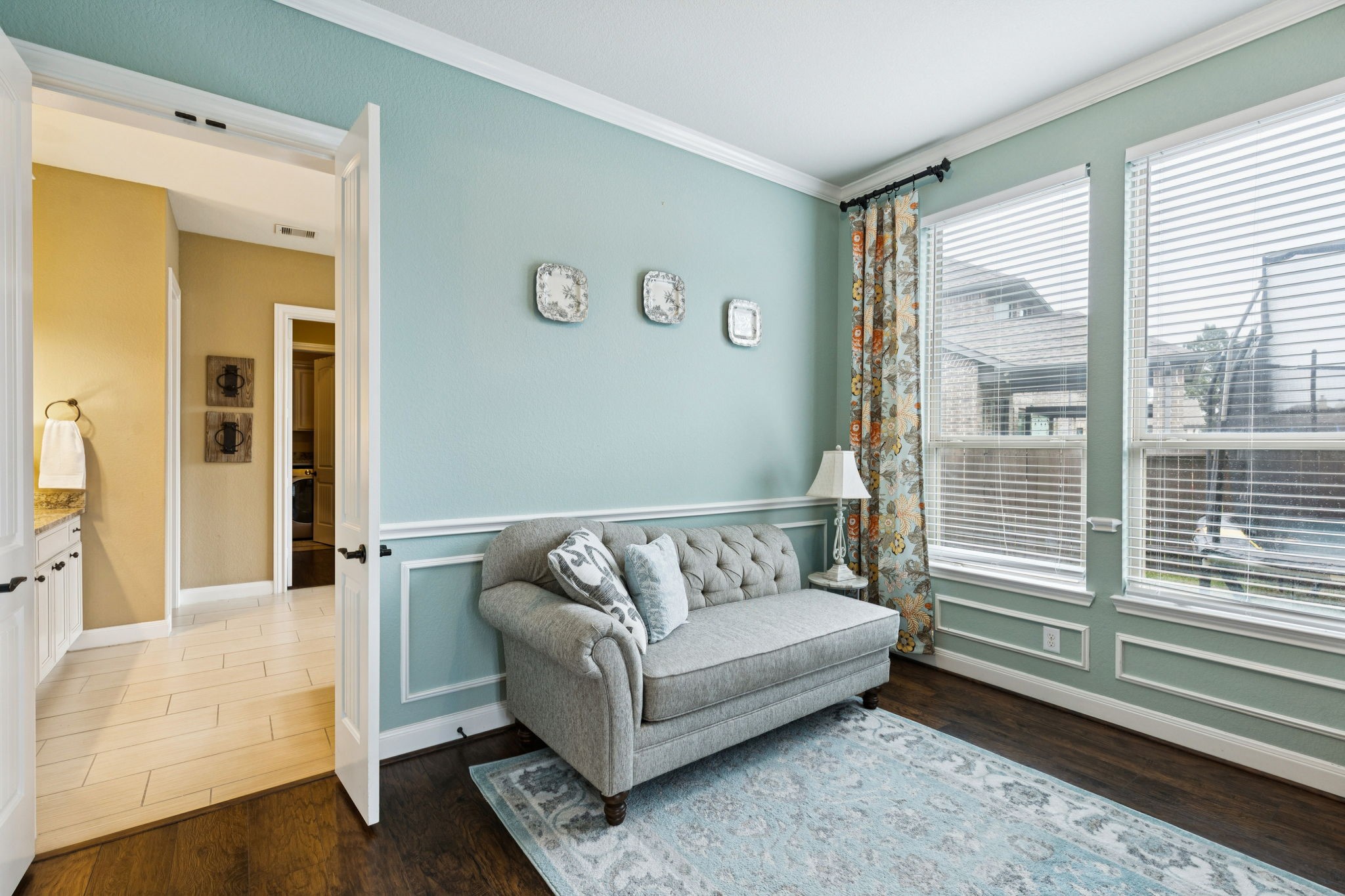 1118 Fragile Sail Court Katy, TX 77494 - Photo 14 of 36 Enjoy a serene sitting room connecting your private primary suite to the bathroom highlighted by classic accent trim and subtle wall paneling that add architectural interest.