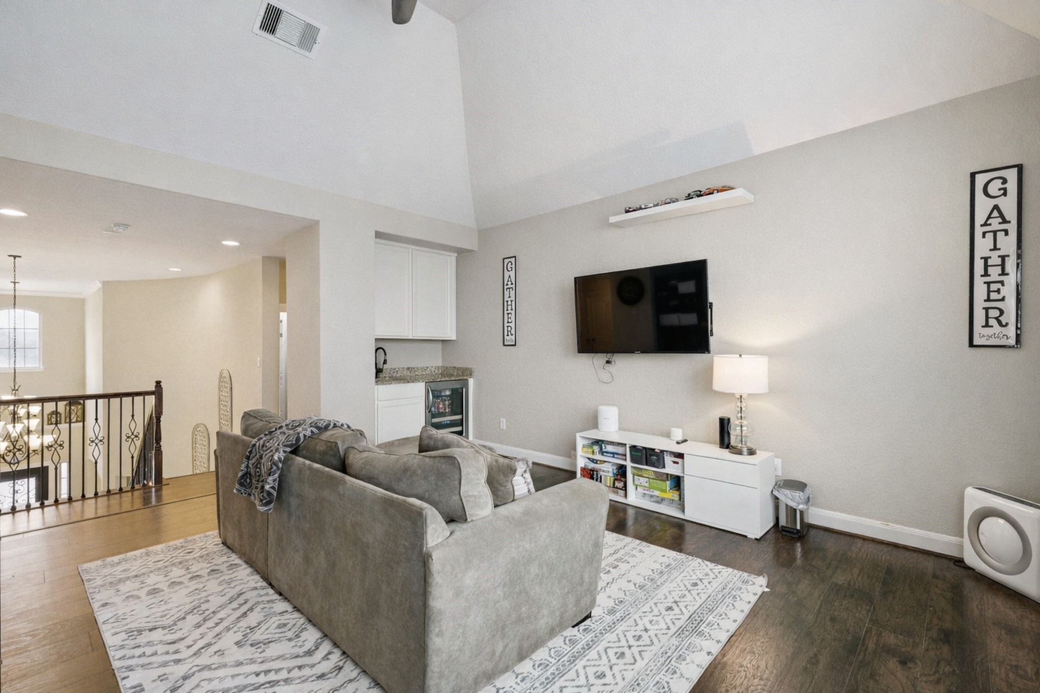 1118 Fragile Sail Court Katy, TX 77494 - Photo 18 of 36 The massive upstairs game room provides the ultimate zone for game nights, hobbies and casual entertaining. It features vaulted ceilings, custom built-ins and a convenient built-in refrigerator—an ideal setup just steps from the second floor secondary bedrooms.
