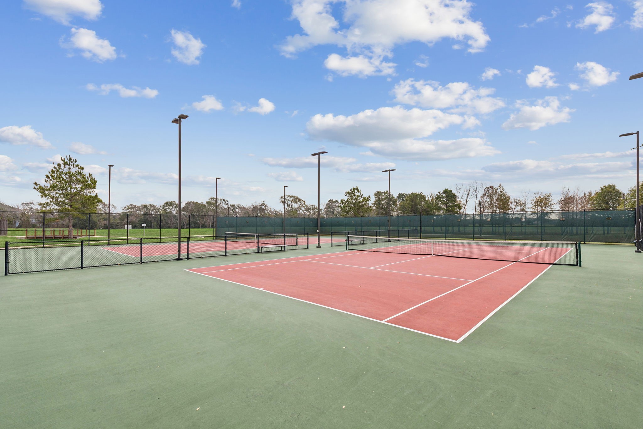 1118 Fragile Sail Court Katy, TX 77494 - Photo 29 of 36 Enjoy access to lighted community tennis courts, perfect for staying active and connecting with neighbors, all within the Trails of Katy master-planned community. An added lifestyle amenity just minutes from shopping, dining, and top-rated Katy ISD schools.