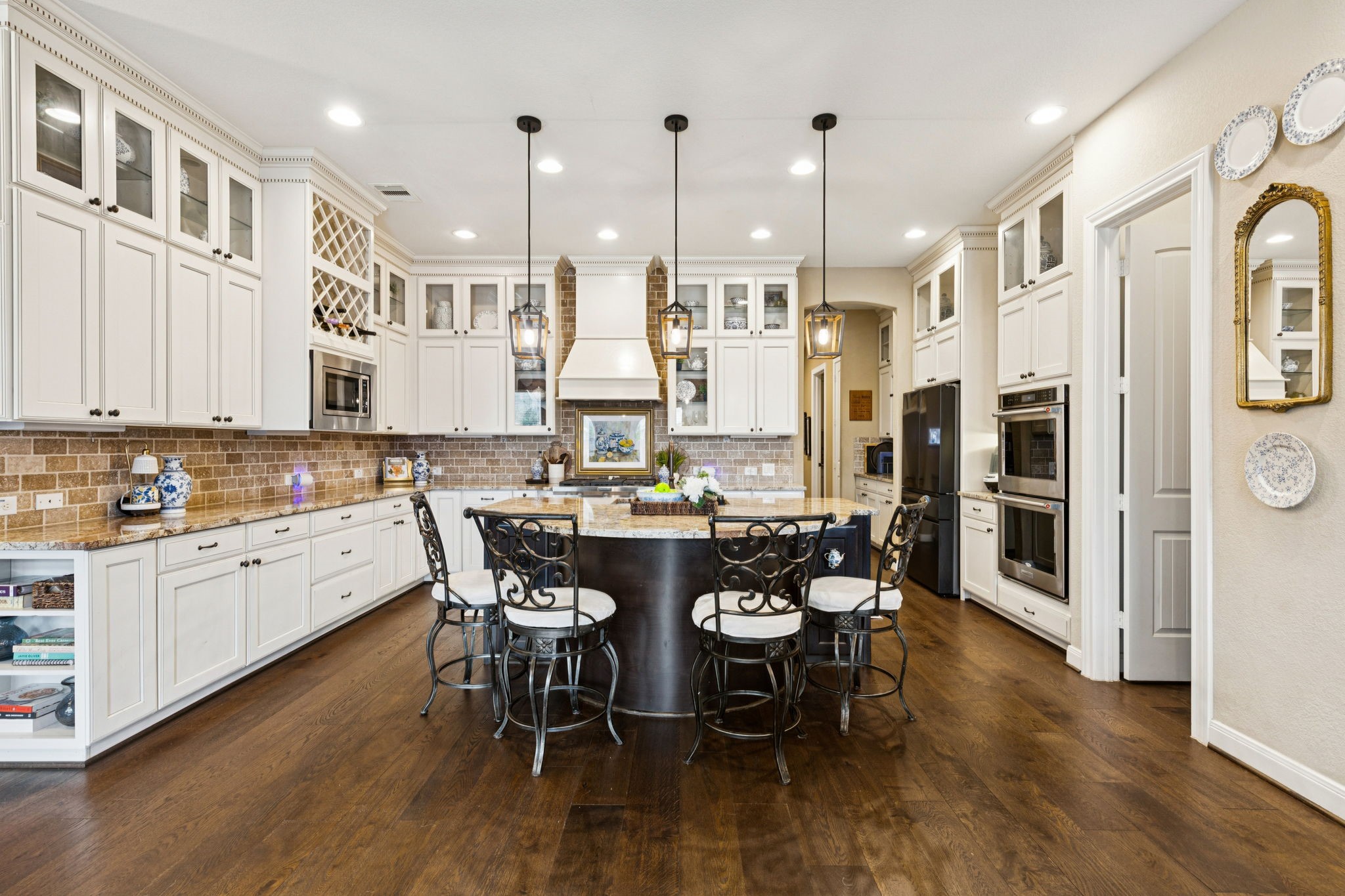 1118 Fragile Sail Court Katy, TX 77494 - Photo 8 of 36 A true culinary hub with a massive granite social island, professional double ovens, and a walk-in pantry.