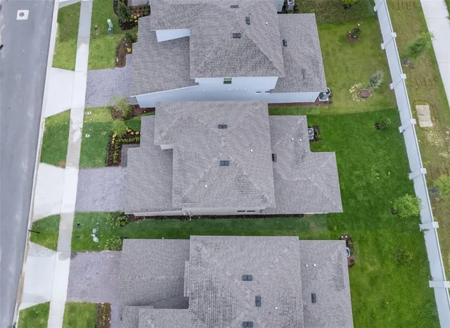 an aerial view of a house with a garden