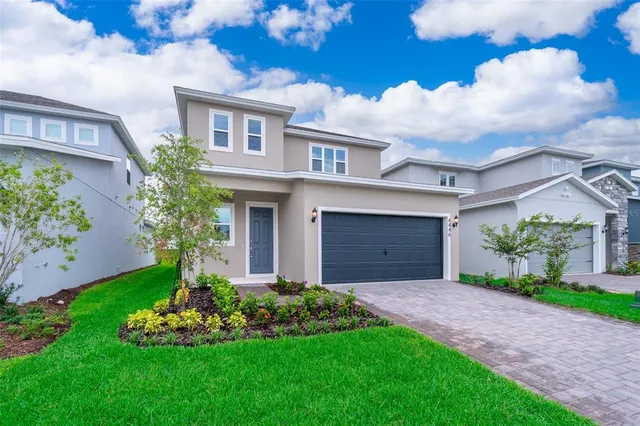 a view of a yard in front of a house