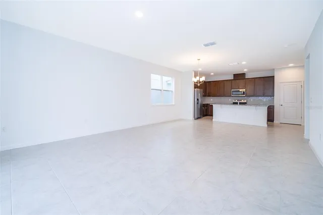 a view of a kitchen with a sink and microwave