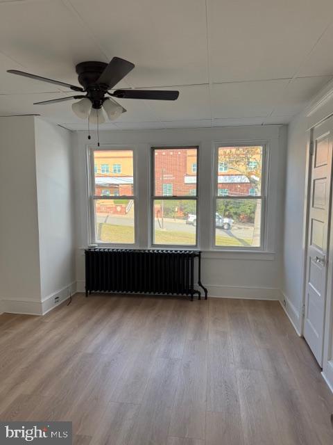 1424 Huddell Avenue Marcus Hook, PA 19061 - Photo 12 of 20 a view of an empty room with a window and wooden floor