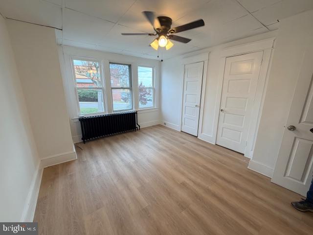 1424 Huddell Avenue Marcus Hook, PA 19061 - Photo 13 of 20 an empty room with wooden floor and windows with curtains